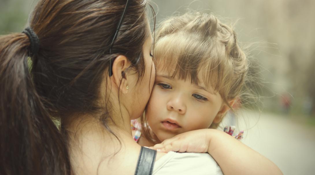 mother holding daughter