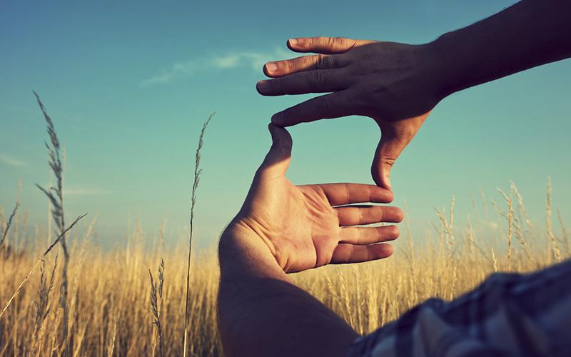 Hands creating a frame